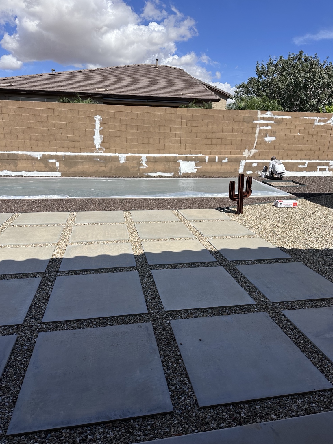 J&S crew preparing and repairing an Arizona block wall before coating