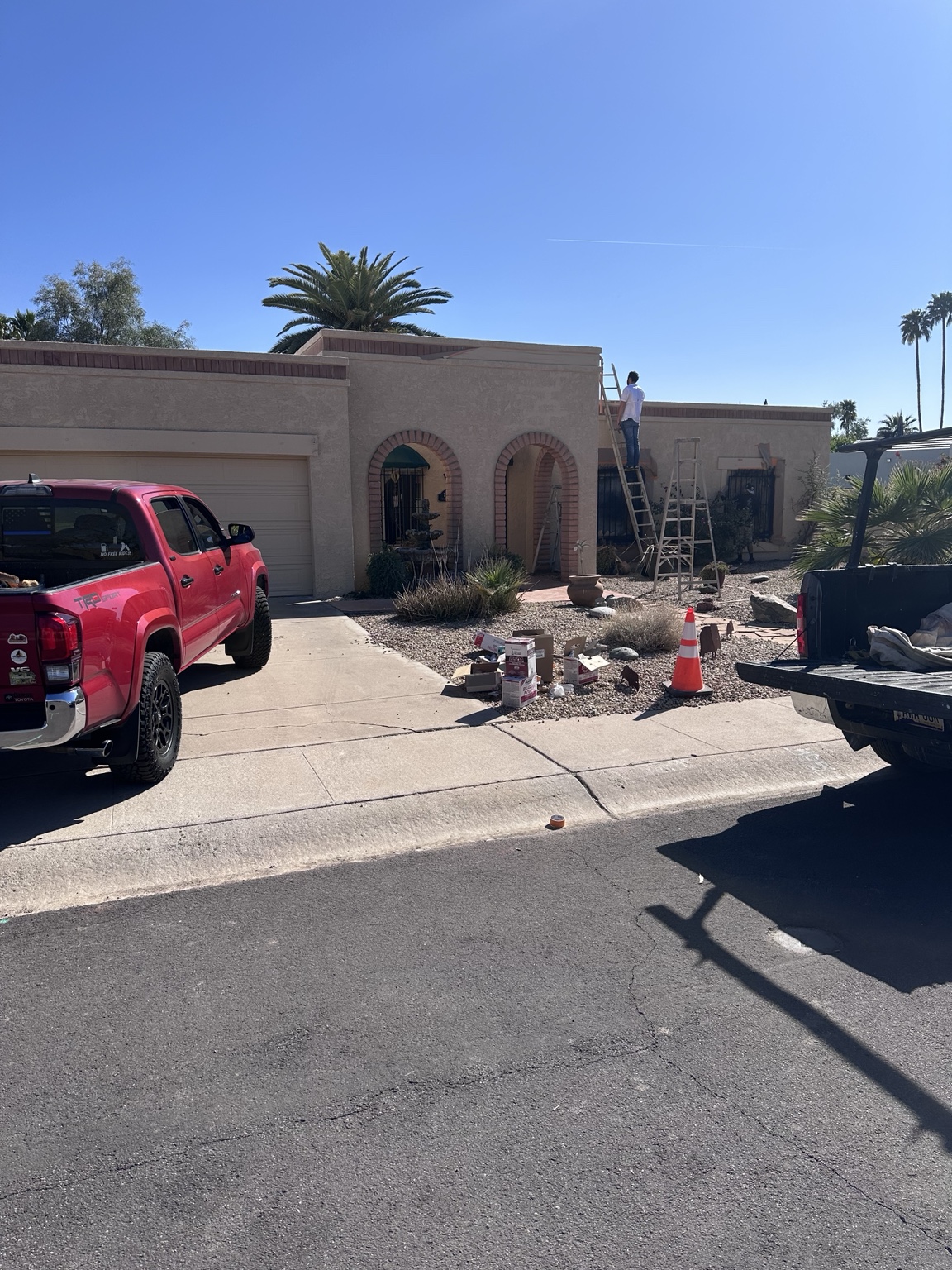 J&S crew preparing an Arizona home exterior for restoration work