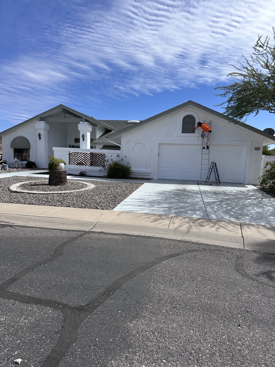 J&S crew completing exterior painting work on an Arizona stucco home