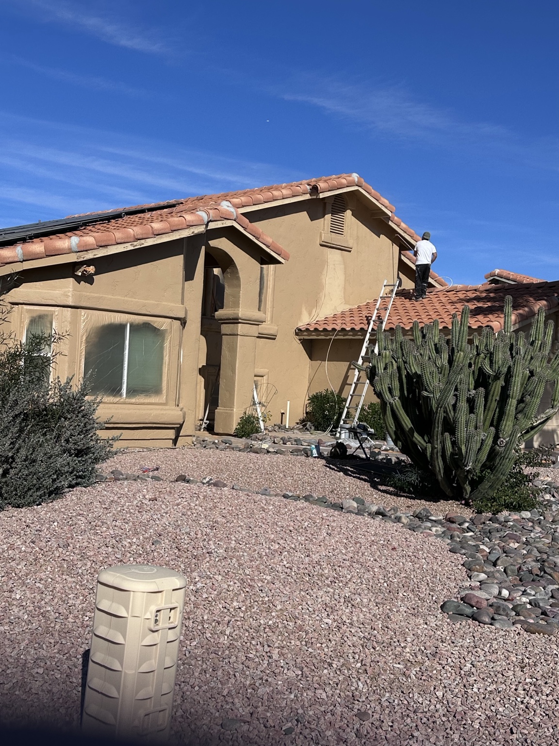J&S crew painting a two-story Arizona stucco home